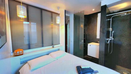Bathroom open to the room Nice